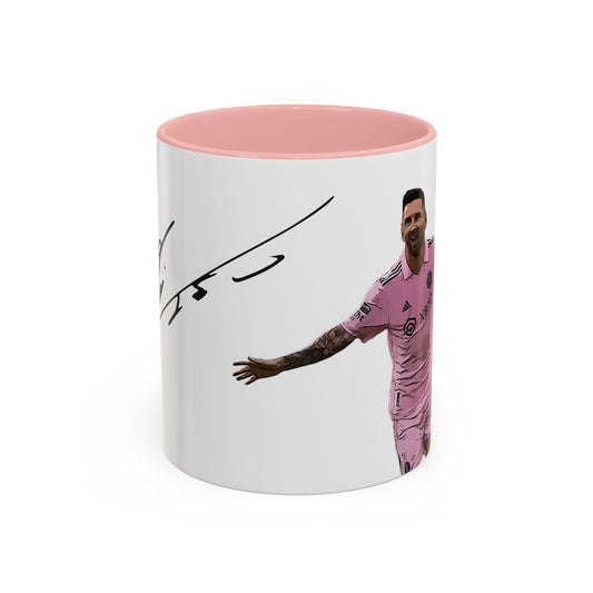 Cartoonized Lionel Messi in Inter Miami pink jersey celebrating with arms wide, signature above, on a 11oz white ceramic mug with pink interior